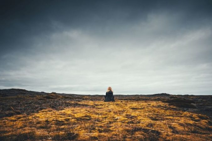Young woman enjoying in Icelandic wilderness.